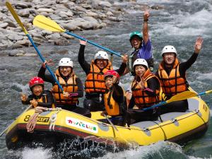 a group of people in a raft on a river at Minakami Outdoor Log & Auto Campsite - Vacation STAY 34002v in Obinata