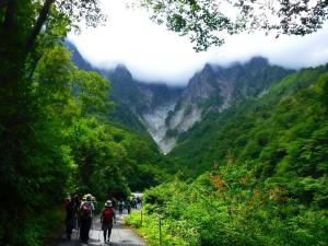 a group of people walking down a path in the mountains at Minakami Outdoor Log & Auto Campsite - Vacation STAY 34002v in Obinata
