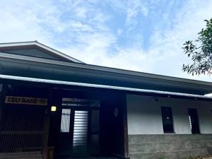 a blue and white building with a sign on it at Izu Base 73 - Vacation STAY 18722v in Okawa +4 photos