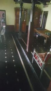 a room with a gym with black and white floors at Krishna sadana beach side home stay in Hangārkatta