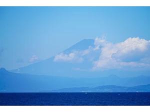 a large body of water with a mountain in the background at &SUN mini mini - Vacation STAY 17824 in Yokosuka +2 photos