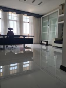 a living room with a table and a couch at Business Apart Arkadia in Odesa