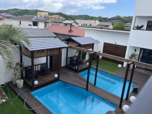 a balcony view of a house with a swimming pool at Onomichi Villa Ayah - Vacation STAY 53618v in Onomichi
