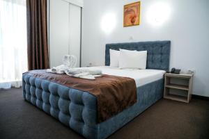 Postel nebo postele na pokoji v ubytování Hotel Astoria + 29 fotografií