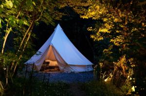 a white tent in the middle of a forest at THEATER 1 - Vacation STAY 40857v in Motojuku +9 photos