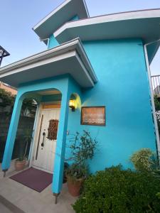 a blue house with a white door at Long - Vacation STAY 56447v in Manazuru