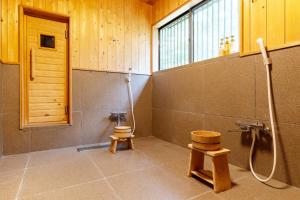 a bathroom with a shower and a toilet in a room at Nasu Premium House - Vacation STAY 17949 in Nasu-yumoto +43 photos