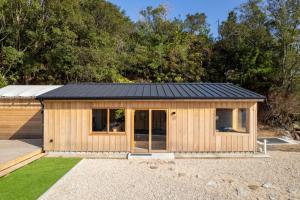 a wooden shed with a black roof at UMILABO - Vacation STAY 64339v in Shima +11 photos