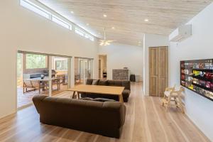 a living room with a couch and a table at UMICHIKA 6886 - Vacation STAY 64201v in Ichinomiya