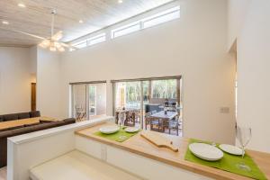 a living room with a couch and a table at UMICHIKA 6886 - Vacation STAY 64201v in Ichinomiya
