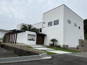 a white building with a lot of windows at Onomichi Villa Ayah - Vacation STAY 53453v in Onomichi