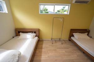 Ένα ή περισσότερα κρεβάτια σε δωμάτιο στο Miyazaki - House - Vacation STAY 18190