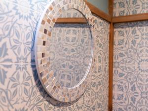 a mirror on a wall with a tile wall at Yadokari 852 - Vacation STAY 56348v in Manazuru +22 photos