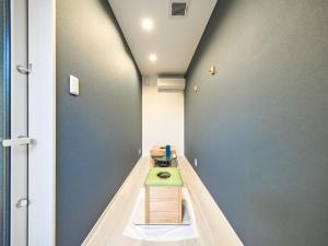 a room with a table in the middle of a room at Chocotto Villa Maestro - Vacation STAY 74566v in Sumoto
