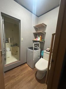 a bathroom with a toilet and a sink and a mirror at Takaoka - House - Vacation STAY 18350 in Takaoka +32 photos