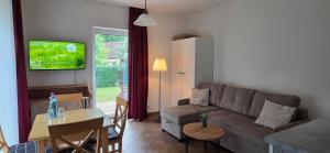 a living room with a couch and a table at Cellino Hotel Prieros in Prieros