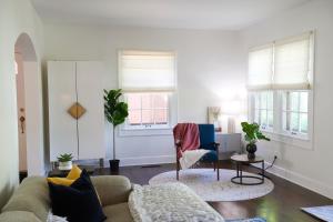 a living room with a couch and a chair at Boston Manor in Indianapolis