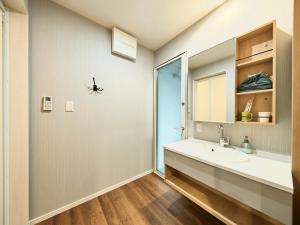 a bathroom with a sink and a mirror at Chocotto Villa Maestro - Vacation STAY 73565v in Sumoto +41 photos