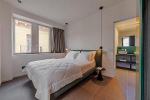 Ένα ή περισσότερα κρεβάτια σε δωμάτιο στο ApartmentsArena - Palazzo Cignaroli