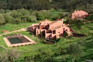 an aerial view of a house with a swimming pool at Vale Palheiro Earth Resort in Aljezur