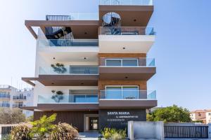 an apartment building with a sign in front of it at Doria 2-Bedroom Apartment & Balcony in Larnaca in Aradhippou