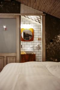 a bathroom with a white sink and a mirror at Pepin Stay in Topoľčany