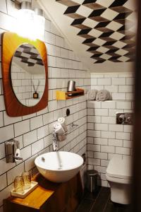 a bathroom with a sink and a mirror at Pepin Stay in Topoľčany +26 photos