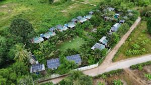 an aerial view of a group of houses with solar panels at Baan Boom Boxes Eco Friendly Resort in Mae Nam
