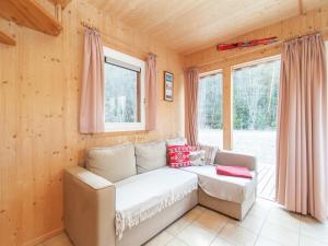 a living room with a couch and a window at Chalet in Stadl near Kreischberg Ski Slopes in Stadl an der Mur