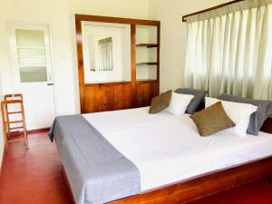 Ένα ή περισσότερα κρεβάτια σε δωμάτιο στο Seasons Homestay