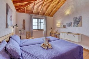 Postel nebo postele na pokoji v ubytování La Hacienda BuenVivir - Apartamentos