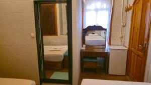 a small bathroom with a sink and a mirror at yıldız saray konuk evi in Sanlıurfa +64 photos