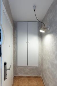 a room with a large white cabinet on the wall at Loft Old Town - Unik Vacation in Tarragona +25 photos