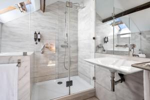 a bathroom with a shower and a sink at Quinta Colina by Shiadu in Lisbon +75 photos