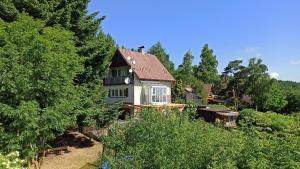 a house sitting in the middle of a forest at Chata Struhadlo in Bezděkov