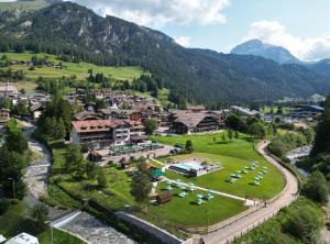 an aerial view of a resort in the mountains at Hotel Rubino Deluxe in Campitello di Fassa