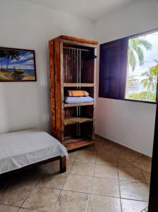Postel nebo postele na pokoji v ubytování Suites Brilho do Sol