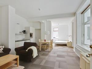 a living room with a couch and a table at Teaterhotellet in Horsens