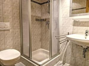 a bathroom with a shower and a toilet and a sink at Apartment Am Weitfeld-3 by Interhome in Längenfeld