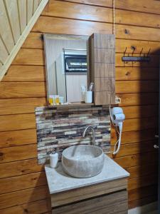 a bathroom with a sink and a mirror at Cozy Cottage A in Kutaisi