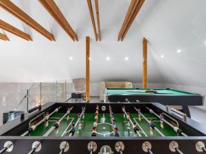 a billiard room with a table and snooker at Holiday Home Luxury Retreat Resort by Interhome 