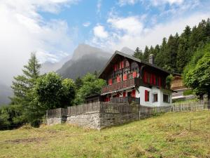 a house on the side of a hill at Chalet Quinette by Interhome in Ovronnaz