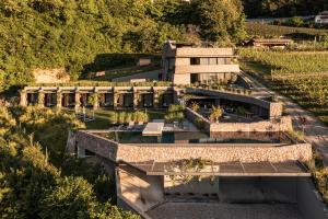an aerial view of a building with a garden at Im Zeitlauf - life with nature in Caldaro