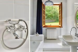 une salle de bain avec douche et lavabo dans l'établissement Villa Diana, à Castelnuovo di Garfagnana