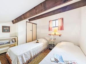 Katil atau katil-katil dalam bilik di Holiday Home Les Maisons de la Plage-14 by Interhome