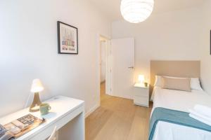 Katil atau katil-katil dalam bilik di Gran apartamento tipo loft a 15 minutos del centro