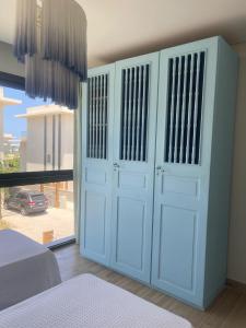 a bedroom with a white door with a window at Almaza Bay in Alexandria +5 photos