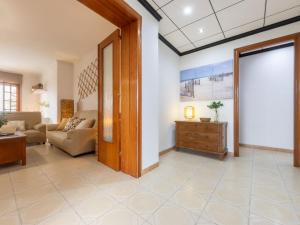 soggiorno con porta che conduce al soggiorno di Holiday Home Corbella by Interhome a Sant Jaume d'Enveja