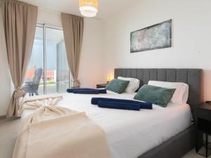 a bedroom with two beds and a balcony at Apartment Heaven Free Spa & Padel by Interhome in Torrox Costa