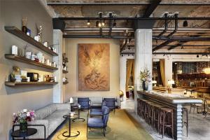 a living room with a couch and a piano at Telegraphenamt in Berlin